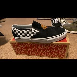 Vans “tiger check” slip ons